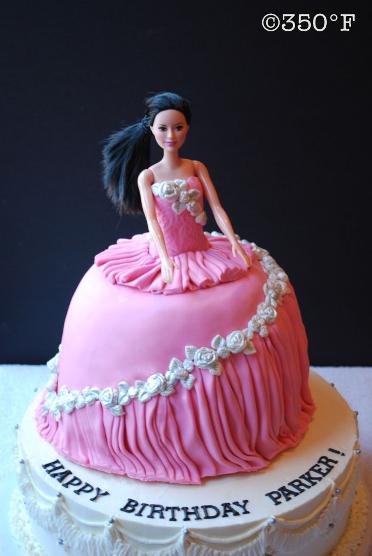 Custom cake with dark hair Barbie and pink dress in Queens, NY