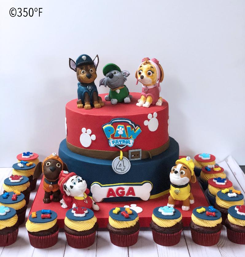 Paw Patrol themed dessert table with combination of cupcakes and cakes with all Paw Patrol pups designed by 350 Degree Fahrenheit