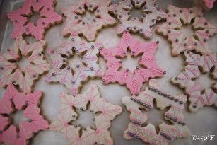 Pink, white and silver snowflake cookies for a winter wonderland themed sweet 16 party