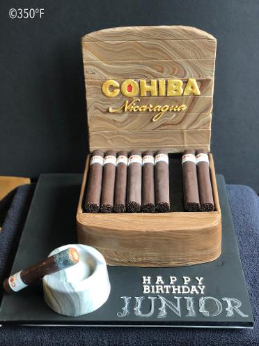 A cigar box cake accessorized with a personal ashtray cake for a 40th birthday party
