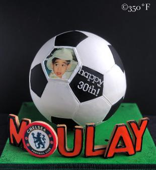 Chelsea themed soccer ball cake with name spelt in cookie