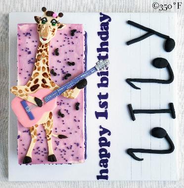 A giraffe playing a guitar was what Lily loves. Here's her first birthday cake.