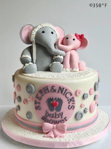 baby shower cake with mama and baby girl elephant toppers