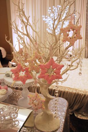 Snowflake cookies hanging on a dessert tree at a Sweet 16 party
