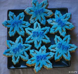 Custom monogram snowflake cookies for a winter theme birthday party favor