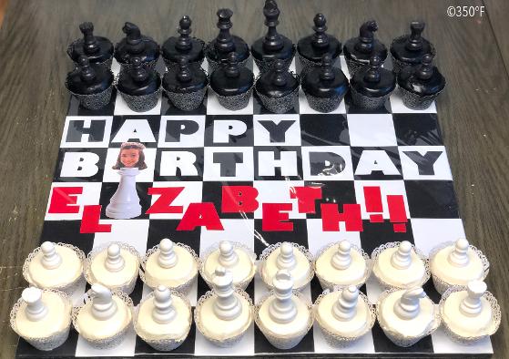 chess set cupcakes with a custom display board and chocolate chess pieces