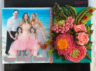 family picture adorned with buttercream flowers for a birthday