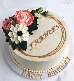 a floral buttercream cake for a centenarian
