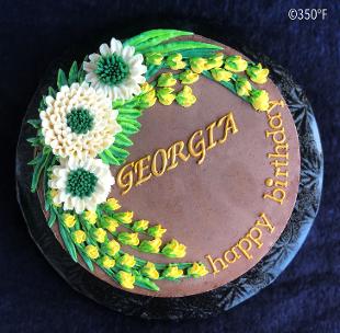 A cake with buttercream flowers sweetened with honey for a daughter's birthday