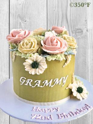 buttercream floral cake for a 72nd birthday in pastel colors