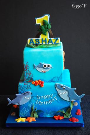 baby shark themed tiered are for a 1st birthday
