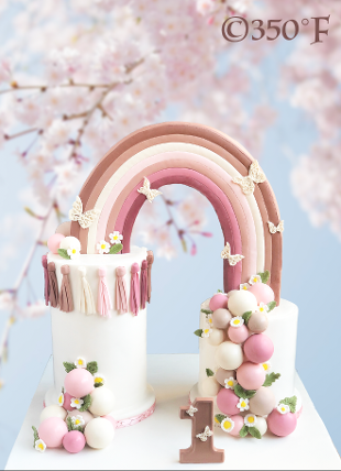 deconstructed tiered cake with neutral colors and rainbow