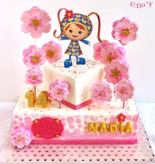 Milli-themed tiered cake with floral cakepops for a 14th birthday party