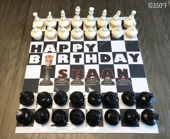 Chocolate chess pieces arranged on cupcake play pieces on a custom made chess board