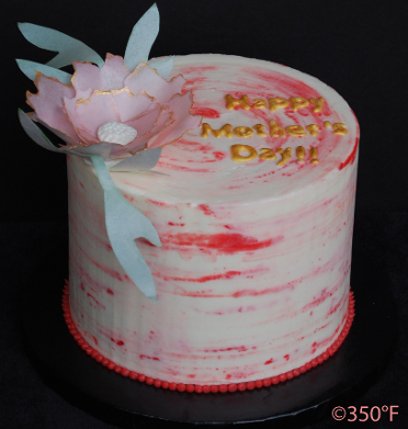 Mother's Day cake in white, pink and gold with a beautiful wafer paper flower topper