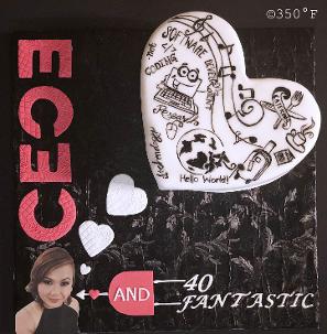a heart shaped 40th birthday cake with graffitti art