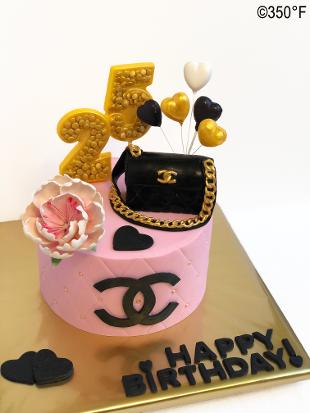 Chanel themed cake with bag, balloons, and flowers