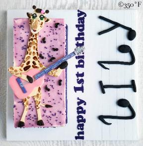 A giraffe playing guitar made out of fondant Lily's 1st birthday party