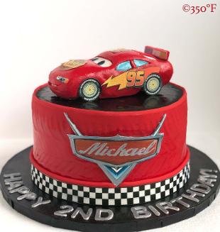 Lightning McQueen topper on a 2nd birthday cake