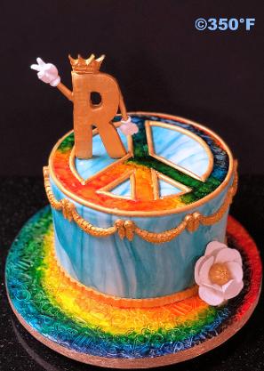 A marble effect in blue, gold and tie-dye color scheme 17th birthday cake