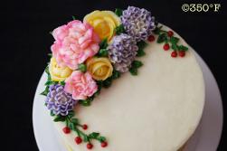 A floral buttercream cake looking pretty and tasty - a after-dinner dessert of mocha cake and caramel filling