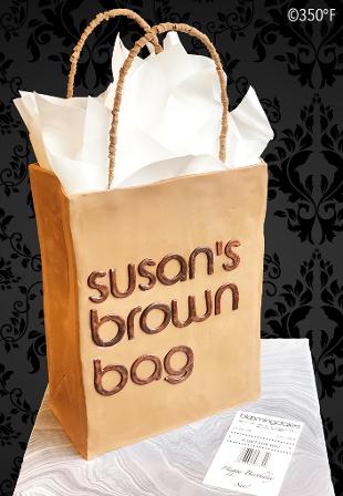 A bloomingdales bag cake customized with the recipient's name