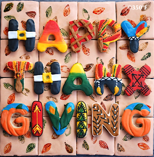 Thanksgiving themed cookie puzzle that spells out Happy Thanksgiving by Custom Cakes