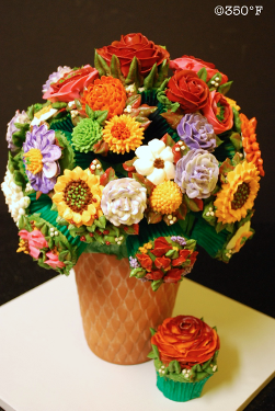 A beautiful cupcake bouquet with a variety of colorful flowers for a holiday party