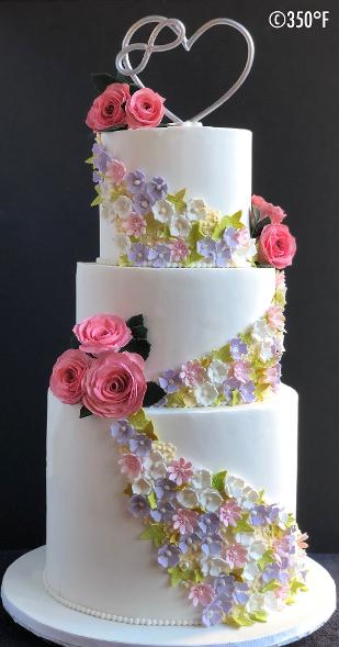 floral wedding cake with infinite love cake topper